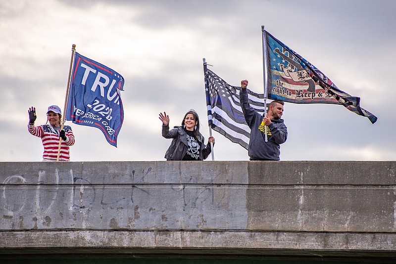 Trump supporters wave at traffic over Hwy 54/63 as part of the MAGA Drag the Interstate Rally Saturday afternoon in Jefferson City.  (Ken Barnes / News Tribune)