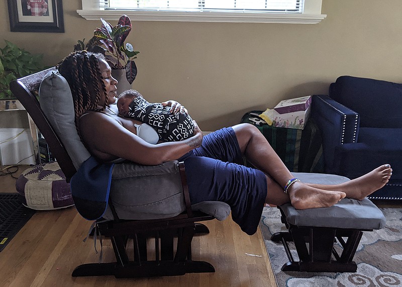 Since her home birth in August, TaNefer Camara has been posting videos and the story of her delivery on social media as an example to other African American women. "Now I'm hearing from Black women who didn't even know that home birth was an option for them," she says. (Photo by Rachel Scheier/California Healthline/TNS)