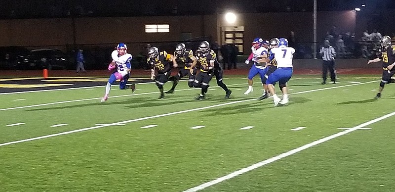 <p>Democrat photo/Kevin Labotka</p><p>Drake Schlup gets around Versailles defenders Oct. 2 during the Pintos’ win over the Tigers.</p>