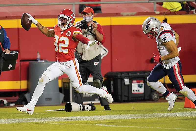 Chiefs safety Tyrann Mathieu returns an interception 25 yards for a touchdown as Patriots wide receiver Julian Edelman trails during Monday night's game at Arrowhead Stadium.