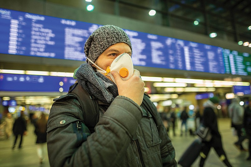 For those traveling by plane, Carlos del Rio, executive dean at Emory University School of Medicine, recommends wearing an N95 face mask if possible, as well as protective eyewear. (Metro Newspaper Service)

