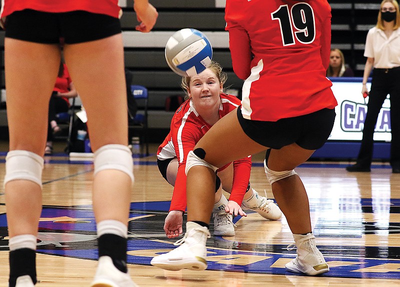 Ada Humphrey of Jefferson City dives to the floor for a dig during Tuesday night's match against Capital City at Capital City High School.