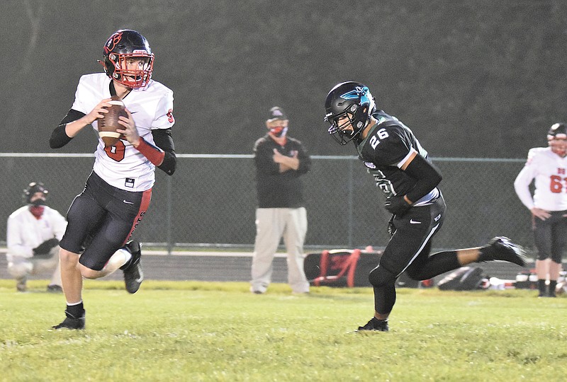 North Callaway defensive back Manny Moreno pursues Bowling Green quarterback Dylan Dalton during last Friday night's game in Kingdom City.