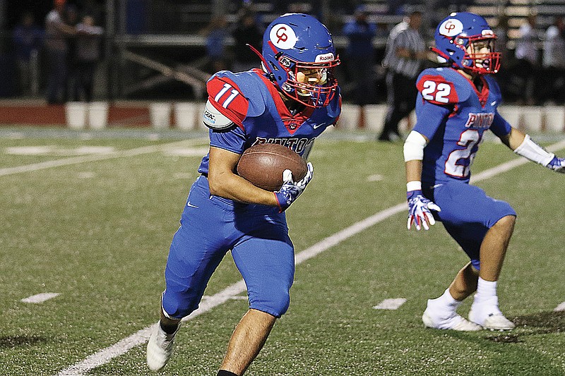 California's Izac Currens looks for room to run with the ball during last month's game against School of the Osage in California.