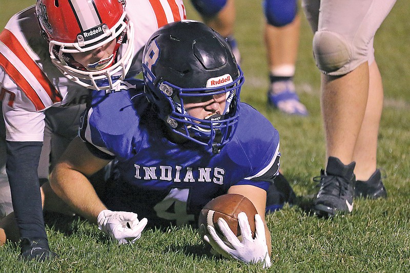 Russellville running back Josiah Herman looks up after being brought down during last Friday night's game against Harrisburg in Russellville.