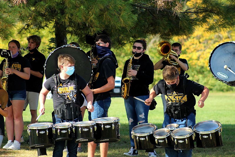 <p>The Fulton High School Band enthusiastically plays for parade-goers. Olivia Garrett/Fulton Sun</p>