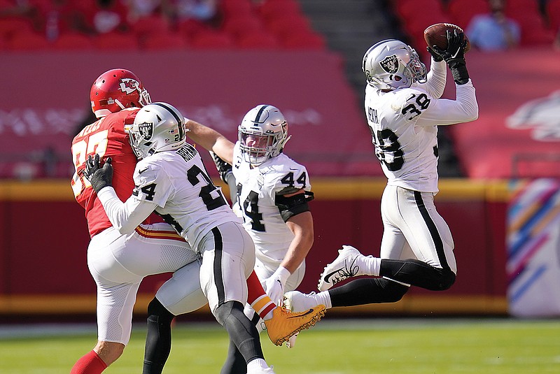 Raiders safety Jeff Heath intercepts a pass intended for Chiefs tight end Travis Kelce during the second half of Sunday's game at Arrowhead Stadium.