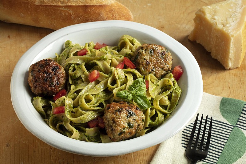 Fettucine with cilantro-almond pesto and chicken meatballs. (E. Jason Wambsgans/Chicago Tribune/TNS) 