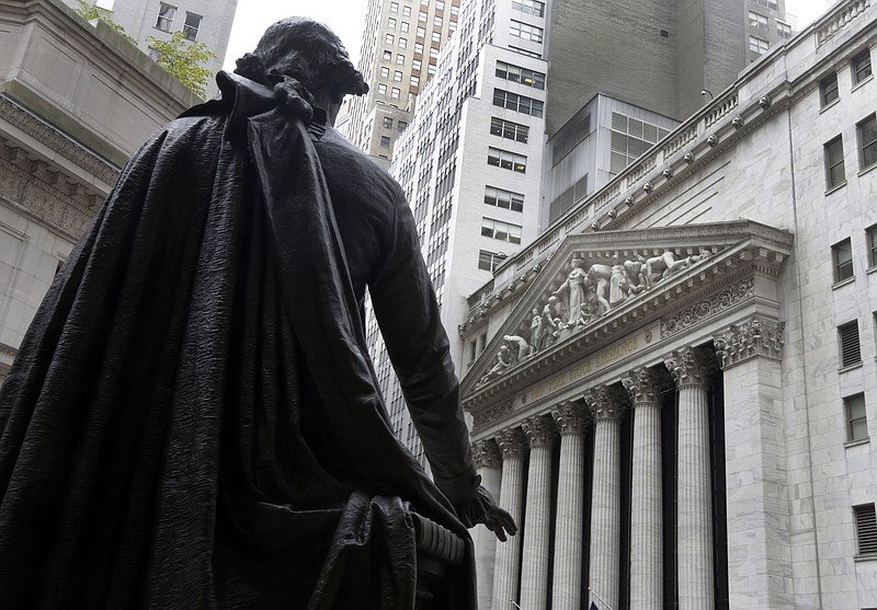 FILE - In this Oct. 2, 2014, file photo, a statue of President George Washington on the steps of Federal Hall faces the facade of the New York Stock Exchange. Wall Street is pushing higher on Monday, Oct. 12, 2020, and tacking more gains onto last week’s rally, its best in more than three months. (AP Photo/Richard Drew, File)