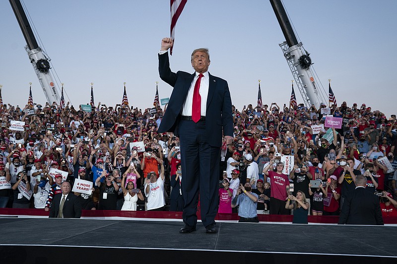 President Donald Trump arrives for a campaign rally at Orlando Sanford International Airport, Monday, Oct. 12, 2020, in Sanford, Fla. (AP Photo/Evan Vucci)