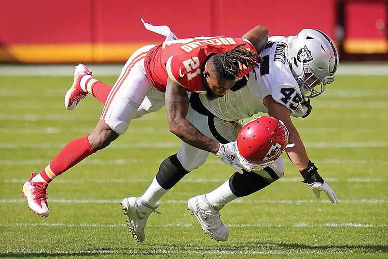 Chiefs cornerback Bashaud Breeland loses his helmet as he tackles Raiders fullback Alec Ingold during the second half of Sunday afternoon's game at Arrowhead Stadium.