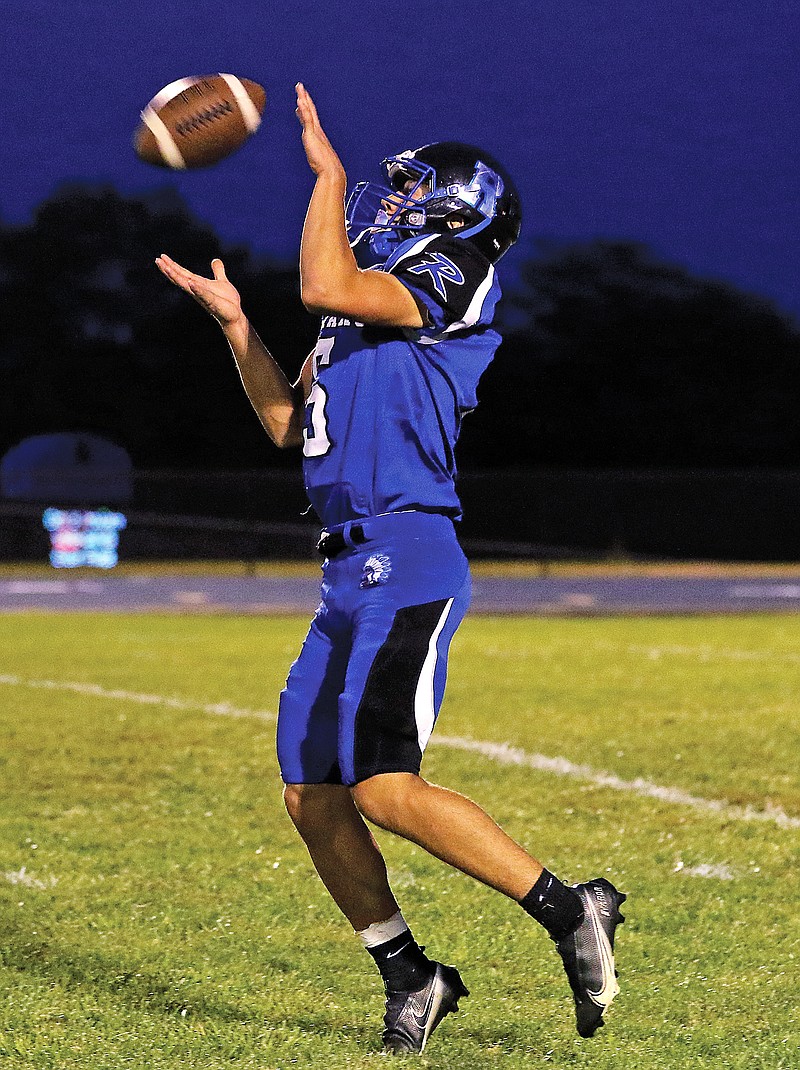 Russellville's Christopher Seaver receives a kickoff during a game earlier this season against Harrisburg in Russellville.