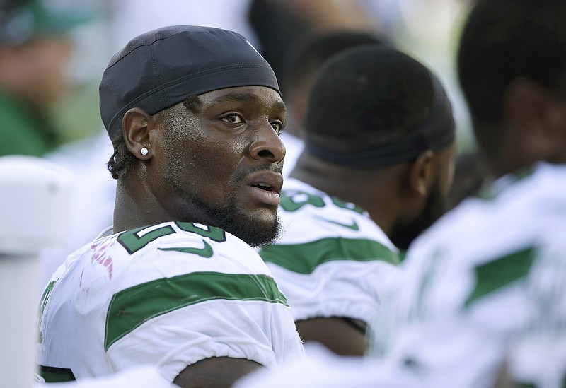 In this Sept. 22 file photo, Jets running back Le'Veon Bell watches from the sideline during a game against the Patriots in Foxborough, Mass. 