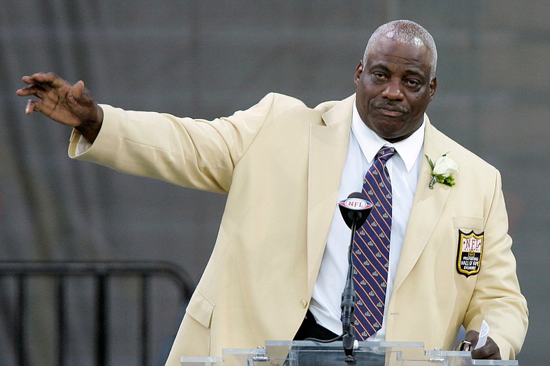 In this Saturday, Aug. 2, 2008, file photo, former San Diego Chargers defensive end Fred Dean waves to fans after his speech at the Pro Football Hall of Fame, in Canton, Ohio. Dean, the fearsome pass rusher who was a key part of the launch of the San Francisco 49ers' dynasty, has died. He was 68. His death on Wednesday night, Oct. 14, 2020, was confirmed Thursday by the Pro Football Hall of Fame in Canton, Ohio. (AP Photo/Mark Duncan, File)