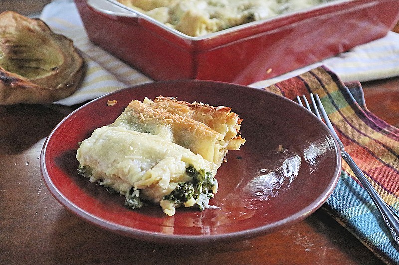 Lasagna gets a vegetarian twist with a filling made from roasted acorn squash and kale, instead of meat. (Gretchen McKay/Pittsburgh Post-Gazette/TNS)