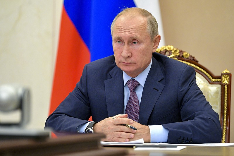 Russian President Vladimir Putin chairs a Security Council meeting via video conference in Moscow, Russia, Wednesday, Oct. 14, 2020. (Alexei Druzhinin, Sputnik, Kremlin Pool Photo via AP)