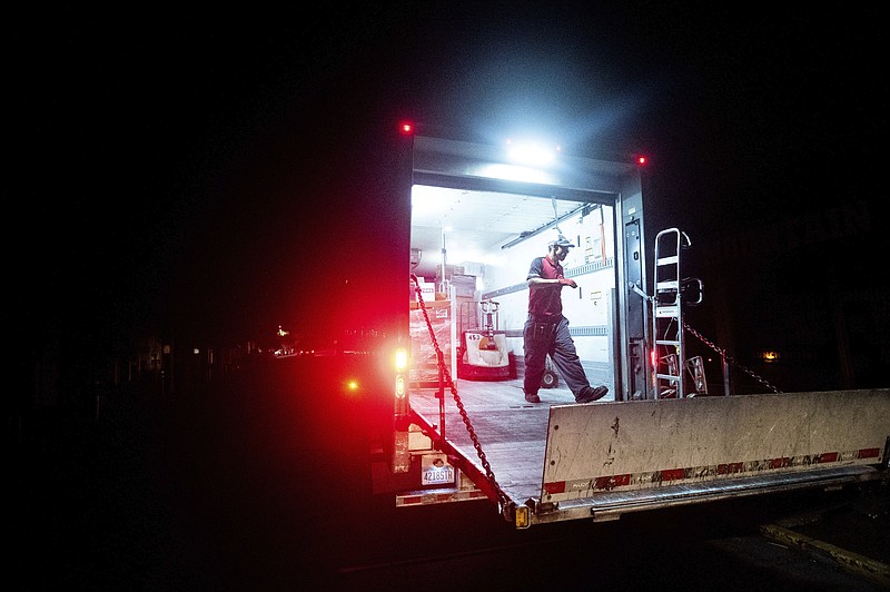 Ray Lopez delivers supplies to Mountain Mike's Pizza in the Montclair district of Oakland, Calif., where power is turned off, on Thursday, Oct. 15, 2020. Pacific Gas & Electric has cut power to portions of Northern California hoping to prevent wildfires during hot, windy weather throughout the region. (AP Photo/Noah Berger)