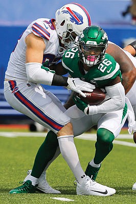 Le'Veon Bell of the Jets is tackled by Trent Murphy of the Bills during a game earlier this season in in Orchard Park, N.Y.