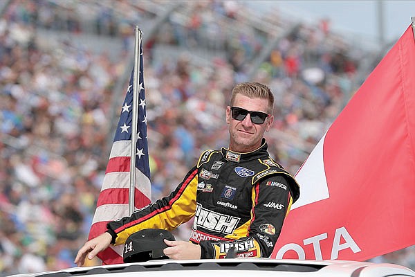 In this Feb. 16 file photo, Clint Bowyer takes a parade lap in front of fans before the Daytona 500 at Daytona International Speedway Daytona Beach, Fla.