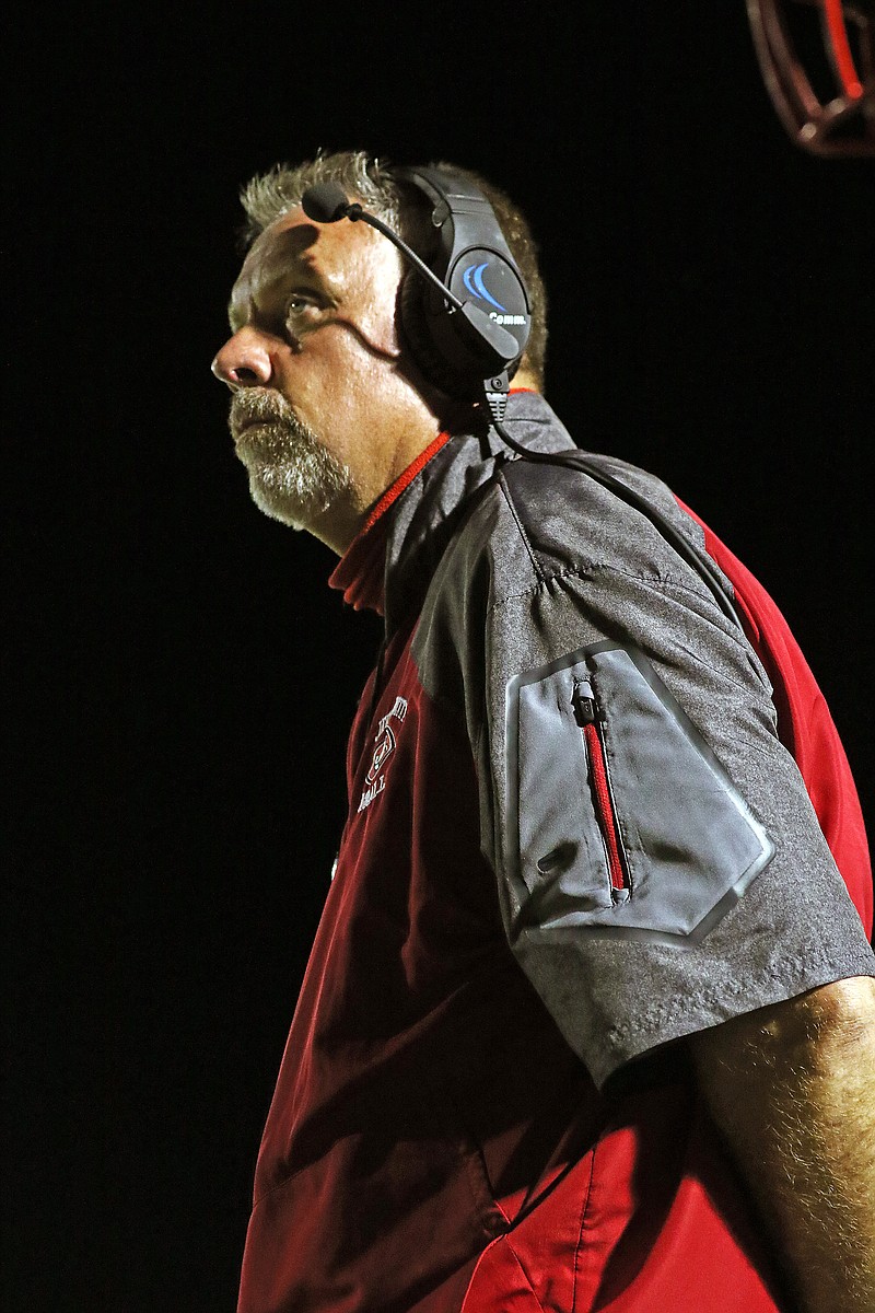 Jefferson City coach Scott Bailey stands on the sideline during a game against Helias at Adkins Stadium.