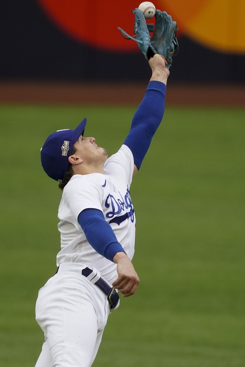 Dodgers second baseman Enrique Hernandez attempts to make a catch during the second inning in Game 6 of the NLCS on Saturday in Arlington, Texas. 