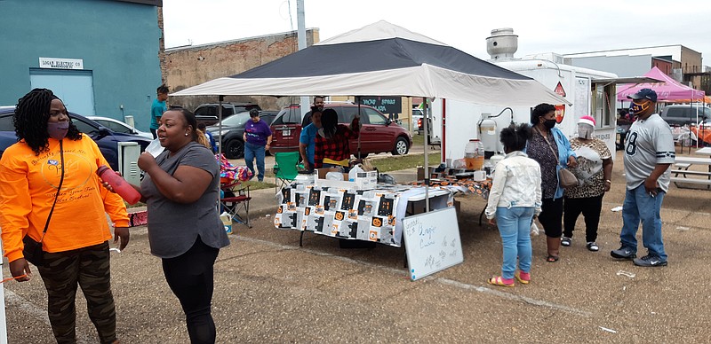 Food adventurers gather at Saturday's Downtown Texarkana Fall Food Fest, which offered a rainbow of flavors all in one spot at the Broad Street Plaza. More than a dozen vendors parlayed their dishes, ranging from barbecue to wings to Vietnamese food and various desserts.
