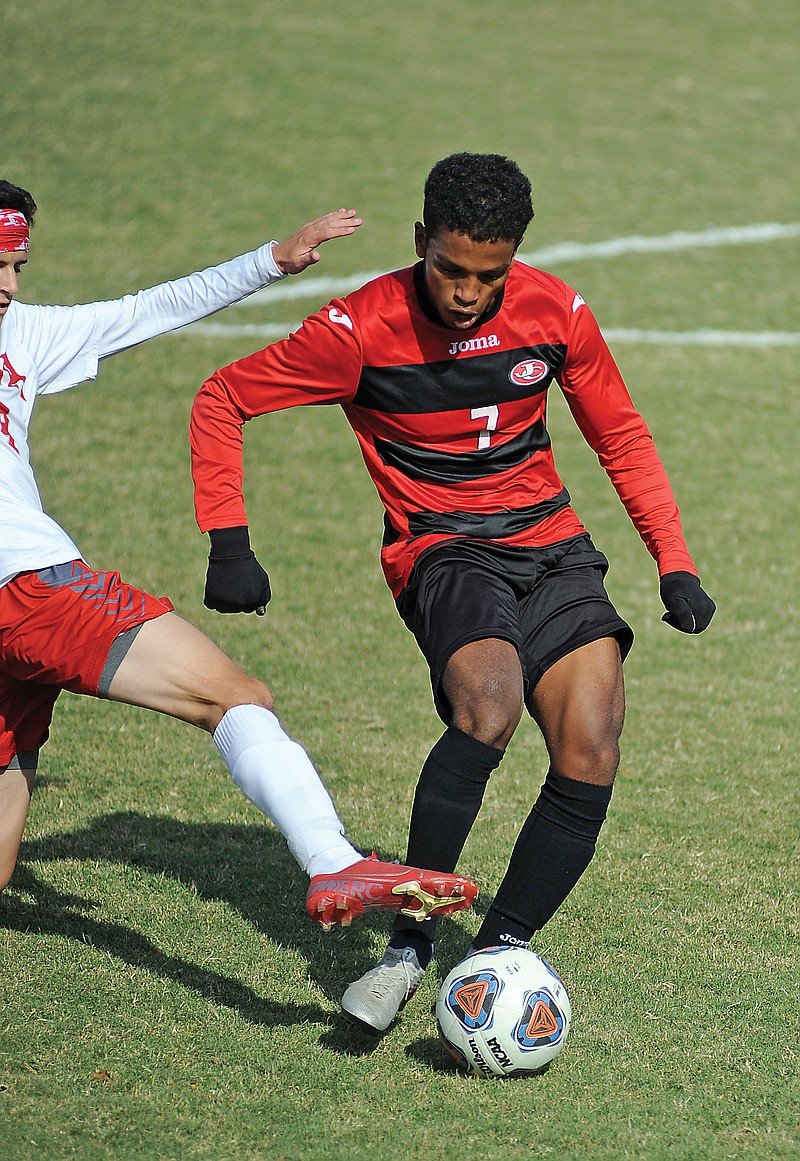 Bassil Ahmed of the Jays takes a shot on goal and scores the Jays' second goal of Saturday's game against Nixa at Eddie Horn Field.