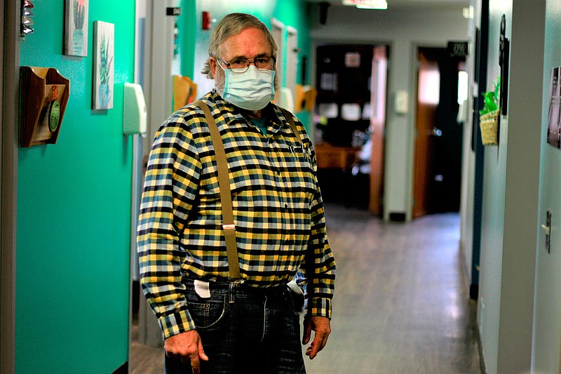 Dr. Tom Dean poses at his clinic in Wessington Springs, S.D., on Friday. Oct. 16, 2020. Dean is one of three doctors in the county, which has seen one of the nation's highest rates of coronavirus cases per person. He writes a column in the local newspaper, the True Dakotan, urging people to take precautions against the virus.(AP Photo/Stephen Groves)