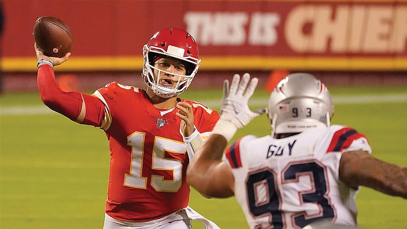 Chiefs quarterback Patrick Mahomes throws as Patriots defensive tackle Lawrence Guy applies pressure during a Monday night game earlier this month at Arrowhead Stadium. Mahomes and the Chiefs will play today against the Bills in Buffalo.