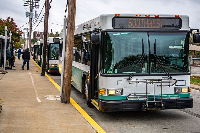 Jefferson City residents transfer between JeffTran buses at the Miller Street station. 