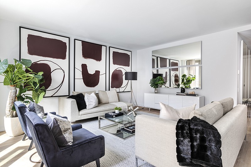 Two one-arm sofas create a sense of symmetry in this modern living room. (Design Recipes/TNS) 