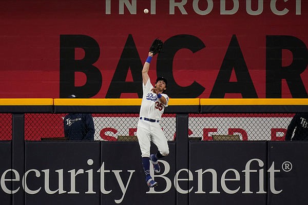Dodgers center fielder Cody Bellinger catches a fly ball hit by Austin Meadows of the Rays during the ninth inning of Tuesday night's Game 1 of the World Series in Arlington, Texas.