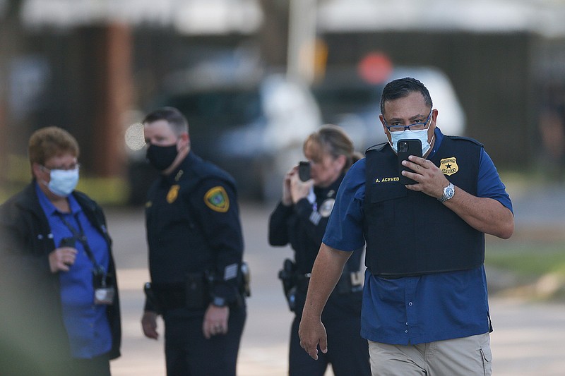 Houston Police chief Art Acevedo walks on the scene of an officer-involved shooting at an apartment complex on Tuesday, Oct. 20, 2020, in Houston. Two Houston officers were shot before a SWAT team was dispatched to the scene, where the suspected shooter was arrested, authorities said. (Godofredo A. Vsquez / Houston Chronicle via AP)