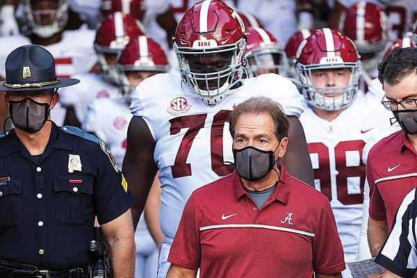 Alabama coach Nick Saban leads his team to the field before a game last month against Missouri at Faurot Field.