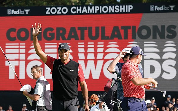 In this Oct. 28, 2019, file photo, Tiger Woods celebrates after winning the Zozo Championship at the Accordia Golf Narashino Country Club in Inzai, east of Tokyo, Japan.