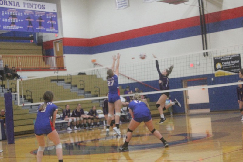 <p>Democrat photo/Kevin Labotka</p><p>Ella Lewis goes up for a block Oct. 20 during the Pintos’ win over Hallsville.</p>