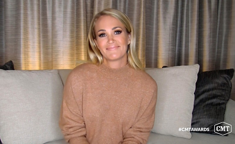 In this video image provided by CMT, Carrie Underwood accepts the female of the year award for "Drinking Alone" during the Country Music Television awards airing on Wednesday, Oct. 21, 2020. (CMT via AP)