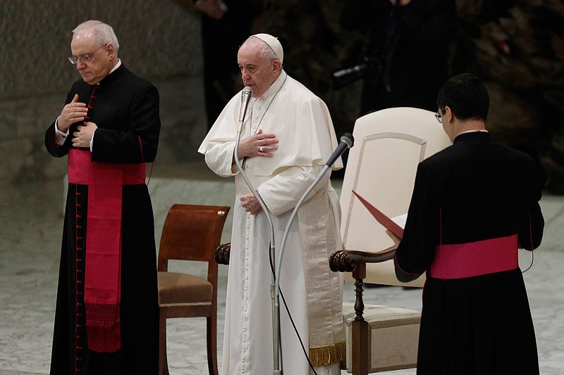 Pope Francis, center, makes the sign of the cross during his weekly general audience in the Paul VI hall at the Vatican, Wednesday, Oct. 21, 2020. Pope Francis endorsed same-sex civil unions for the first time as pope while being interviewed for the feature-length documentary "Francesco," which premiered Wednesday at the Rome Film Festival. (AP Photo/Gregorio Borgia)