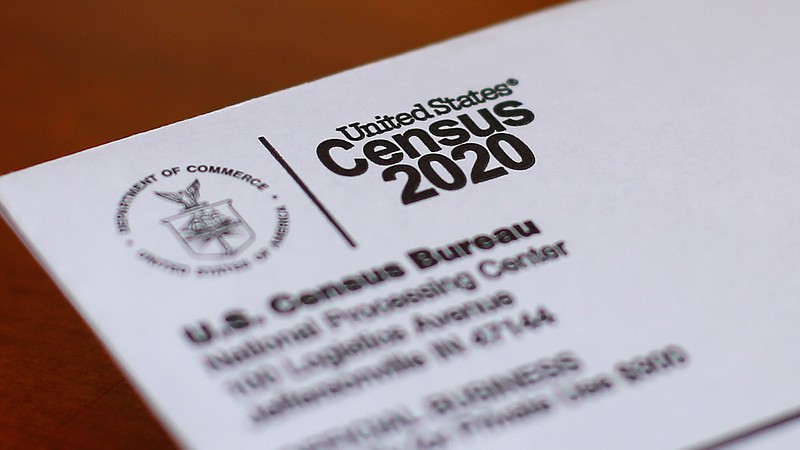 In this Sunday, April 5, 2020 file photo, An envelope containing a 2020 census letter mailed to a U.S. resident is shown in Detroit. A top lawmaker says the Trump administration is seeking to delay deadlines for the 2020 census because of the coronavirus outbreak. U.S. Rep. Carolyn Maloney said Monday, April 13, 2020 that administration officials also were asking that the timetable for releasing apportionment and redistricting data used to draw congressional and legislative districts be pushed back. (AP Photo/Paul Sancya, File)