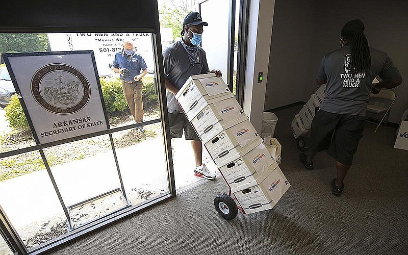 Movers unload boxes of signatures from Arkansas Voters First on Monday, July 6, 2020, at the secretary of state's office in Little Rock. The group was seeking a constitutional amendment that would establish an independent redistricting commission. (Arkansas Democrat Gazette)

