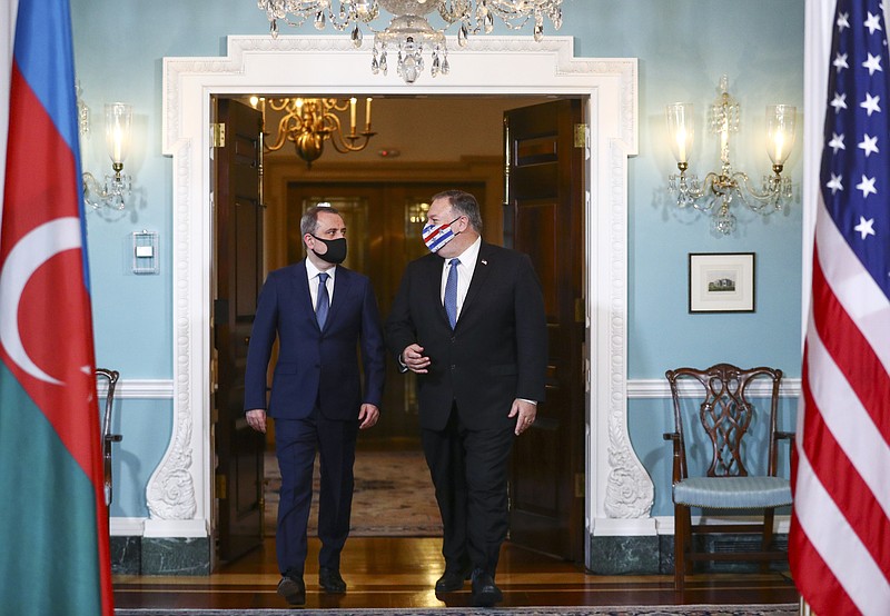 CORRECTS NAME TO AZERBAIJAN FOREIGN MINISTER JEYHAN BAYRAMOV - Secretary of State Mike Pompeo walks out to face reporters with Azerbaijan Foreign Minister Jeyhun Bayramov, prior to holding talks, Friday, Oct. 23, 2020 at the State Department in Washington. (Hannah McKay/Pool via AP)