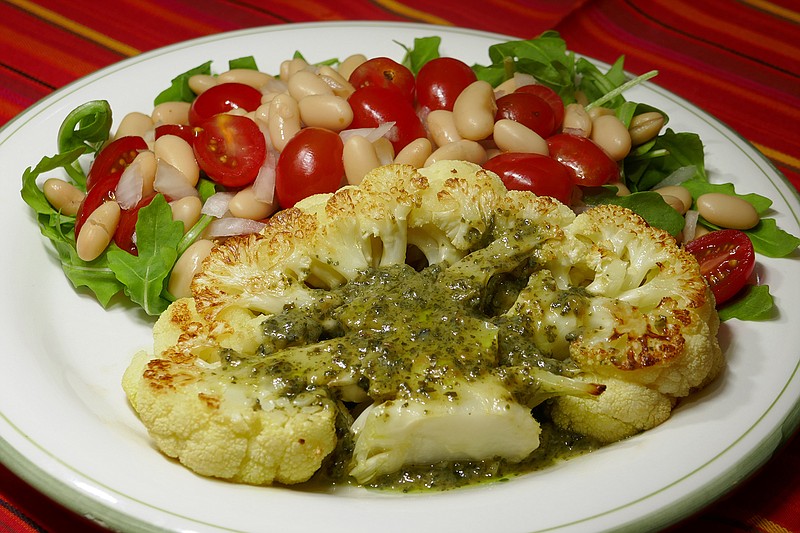 Cauliflower steak with bean and tomato salad. (Linda Gassenheimer/TNS)