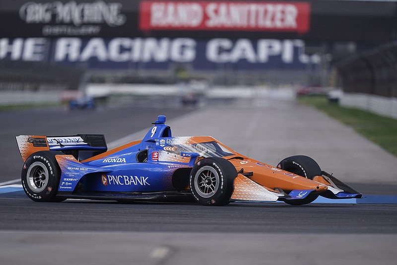 Scott Dixon steers his car Oct. 1 during a practice session for an IndyCar at Indianapolis Motor Speedway in Indianapolis. 