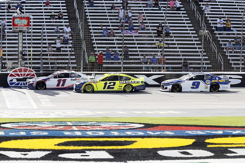 In this July 19 file photo, Denny Hamlin (11), Ryan Blaney (12) and Chase Elliott (9) race down the front stretch during a NASCAR Cup Series race at Texas Motor Speedway in Fort Worth, Texas.