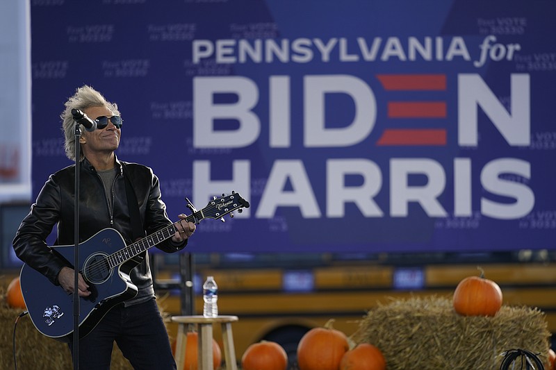 Musician Jon Bon Jovi performs at a campaign event for Democratic presidential candidate former Vice President Joe Biden at Dallas High School in Dallas, Pa., Saturday, Oct. 24, 2020. (AP Photo/Andrew Harnik)