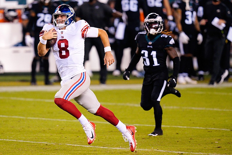 New York Giants' Daniel Jones runs with the ball during the second half of an NFL football game against the Philadelphia Eagles, Thursday, Oct. 22, 2020, in Philadelphia. (AP Photo/Chris Szagola)