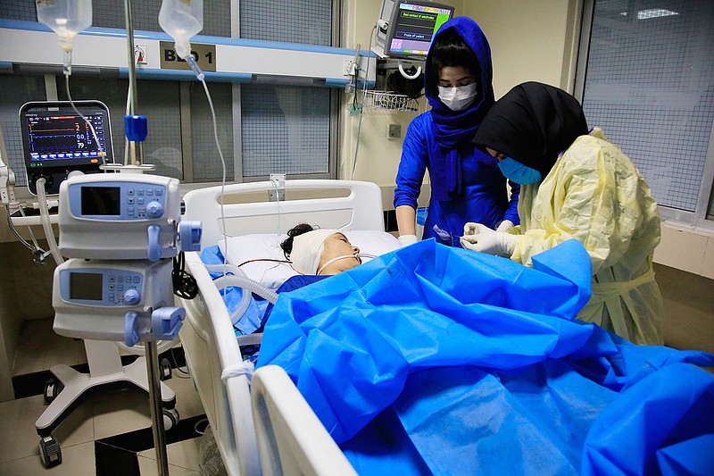 An Afghan receives treatment at hospital after suicide attack in Kabul, Afghanistan, Saturday, Oct. 24, 2020. The death toll from the suicide attack Saturday in Afghanistan's capital has risen that includes schoolchildren, the interior ministry said.. (AP Photo/Mariam Zuhaib)