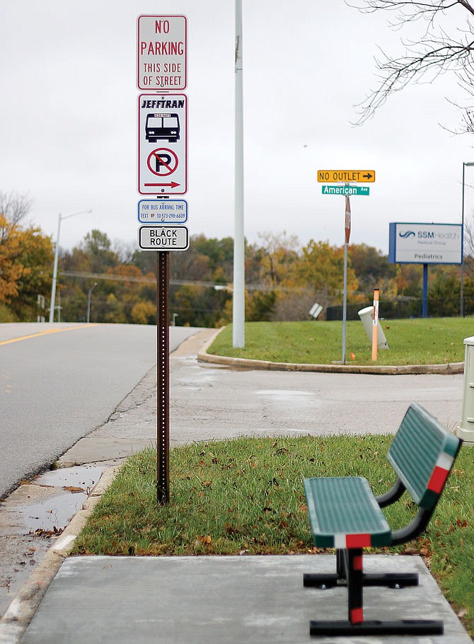 JeffTran bus stops, like the one shown here Friday on the corner of Wildwood Drive and American Avenue, have signs next to them denoting which routes stop by that particular stop. 