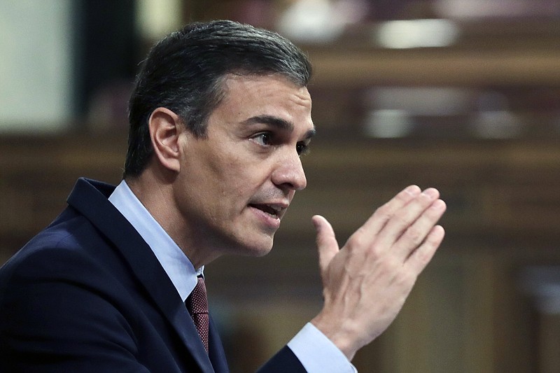 FILE - Spain's Prime Minister Pedro Sanchez speaks during a parliamentary session in Madrid, Spain, Wednesday Oct. 21, 2020.  Sánchez is appealing for Spaniards to pull together and defeat the new coronavirus, warning: “The situation is serious.” Sanchez, in a televised address to the nation Friday, acknowledged public fatigue with restrictions to contain the spread of COVID-19.   (AP Photo/Manu Fernandez, Pool)