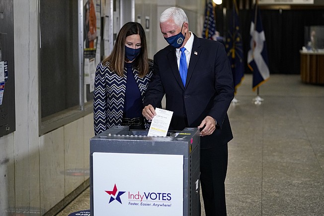 Vice President Mike Pence and his wife, Karen, cast their ballots Friday during early voting in Indianapolis.